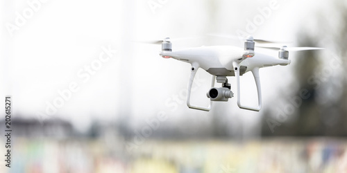 Modern drone flying outdoor, RF photo, no logos or trademarks