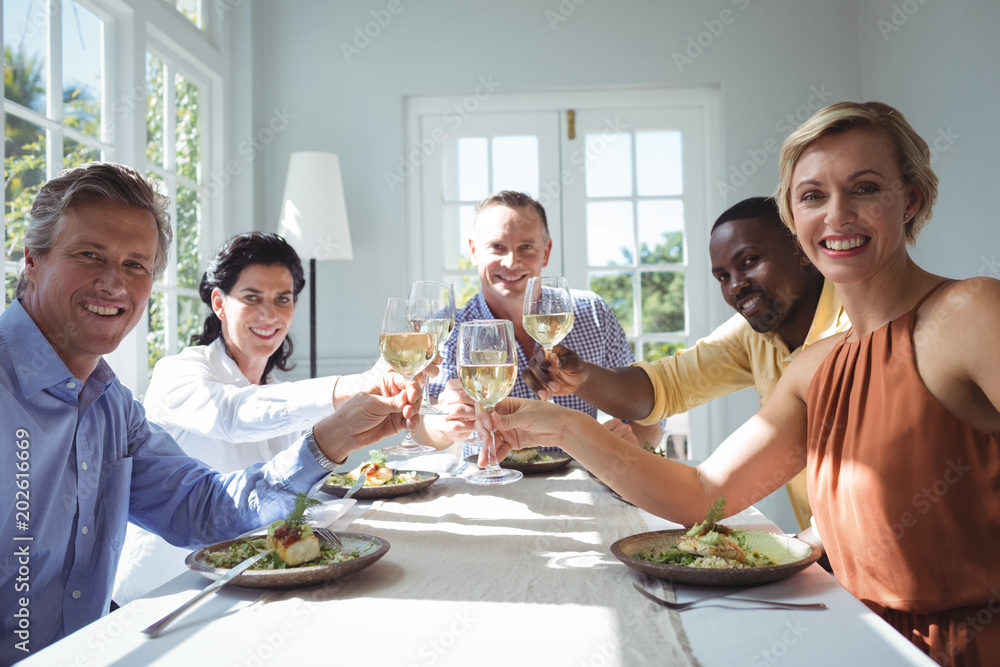 Group of happy friends toasting glasses of wine Group of happy friends toasting glasses of wine