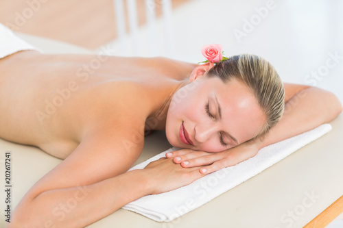 Peaceful blonde lying on towel 