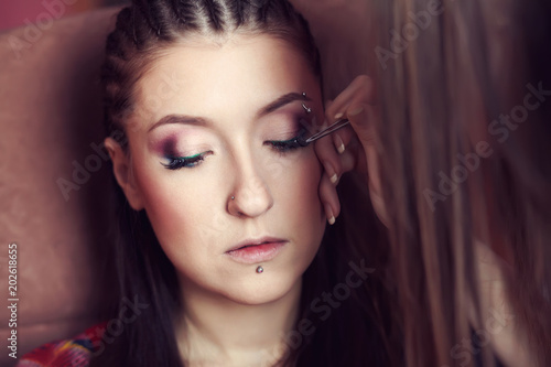 makeup artist making eyeliner eyelashes
