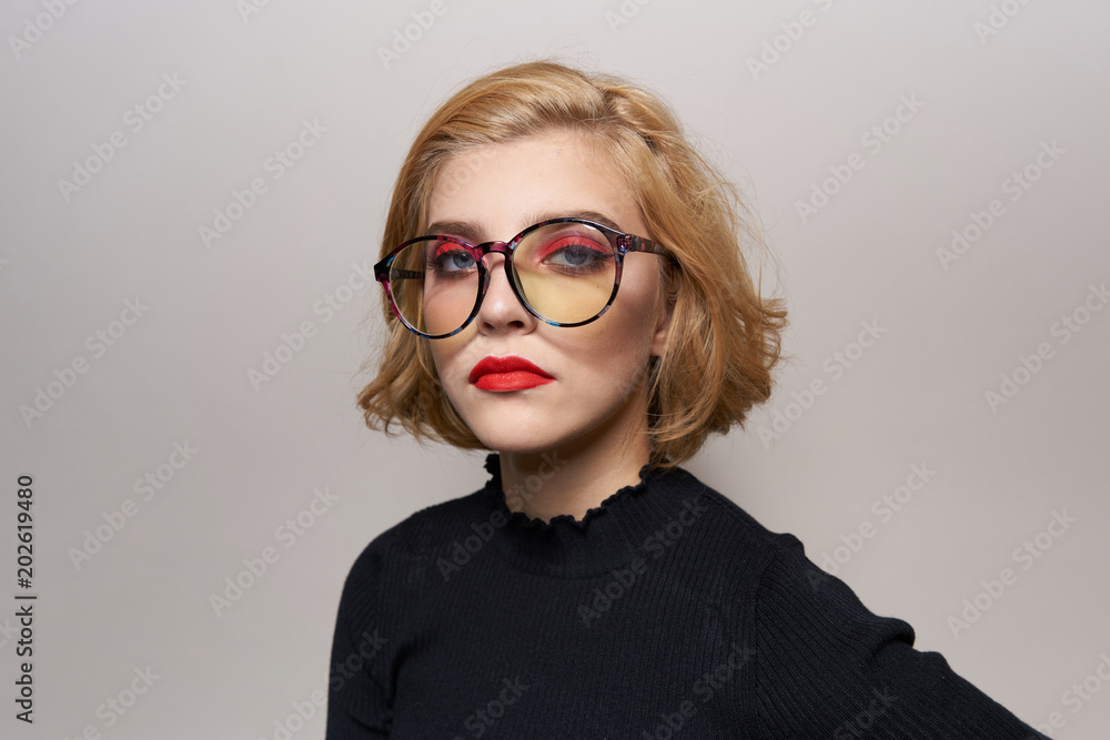 serious woman in glasses with bright makeup portrait serious woman in glasses with bright makeup portrait