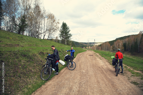 group of tourists in a hike on bicycles