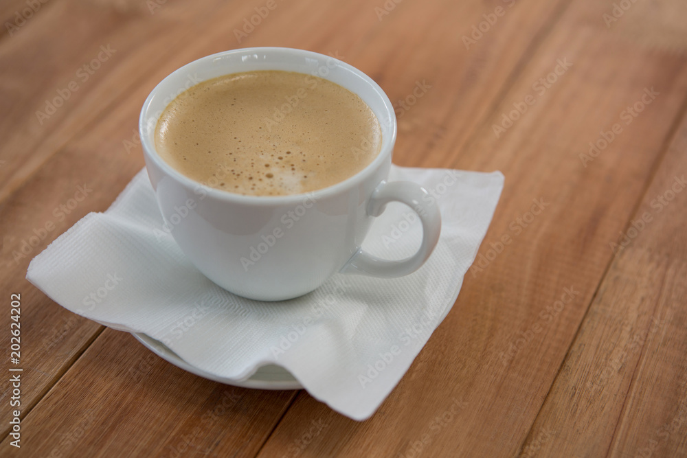 Coffee served with tissue paper Coffee served with tissue paper