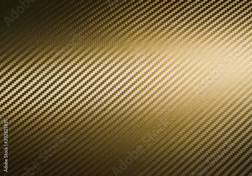 Metallic shiny texture of gold carbon fiber self-adhesive paper. Material for racing car modification. Material design for background, wallpaper, graphic design photo