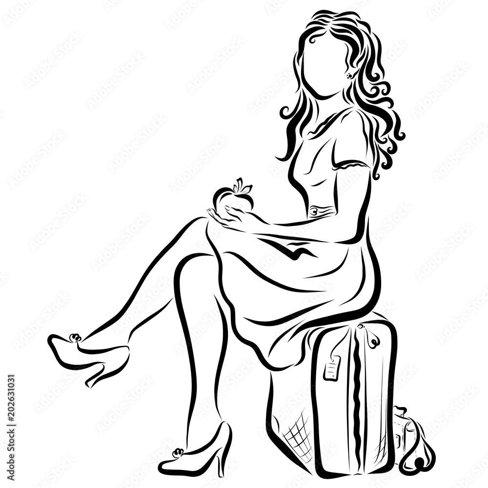 A slender young fashionable woman sits on a suitcase and holds an apple