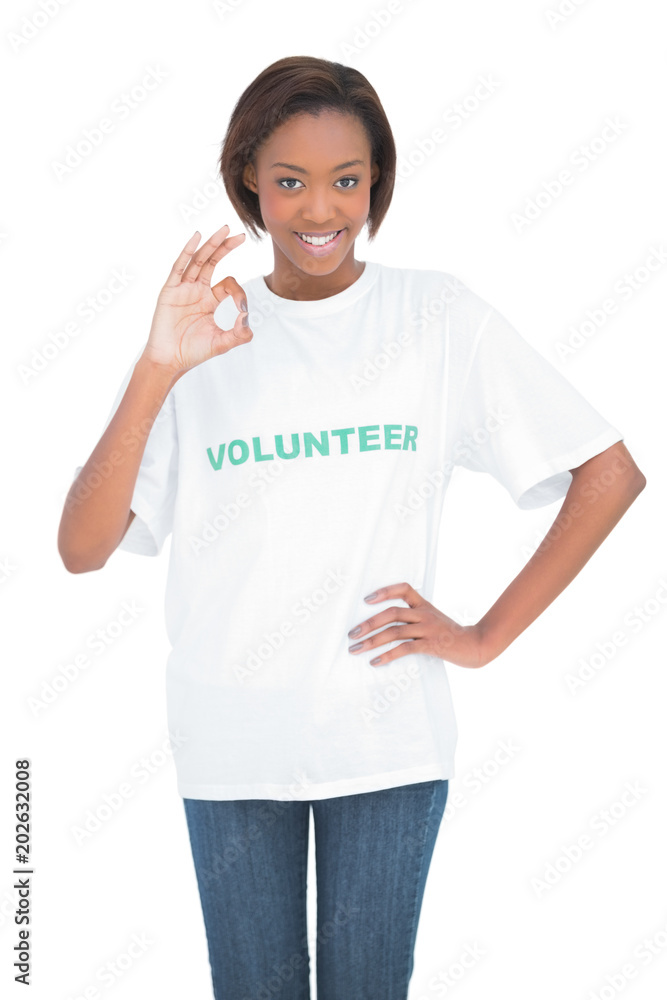 Pretty woman with volunteer tshirt making okay gesture Pretty woman with volunteer tshirt making okay gesture