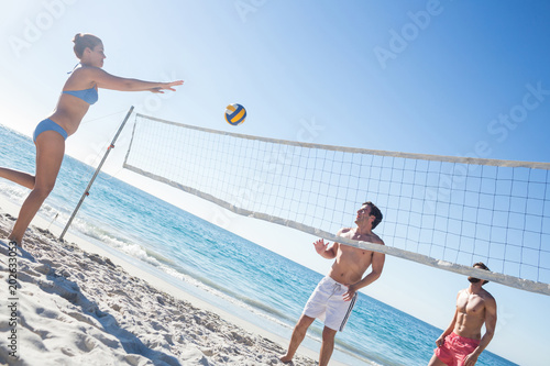 Friends playing volleyball