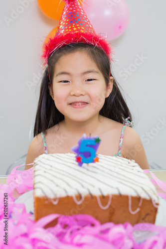 Smiling little girl at her birthday party