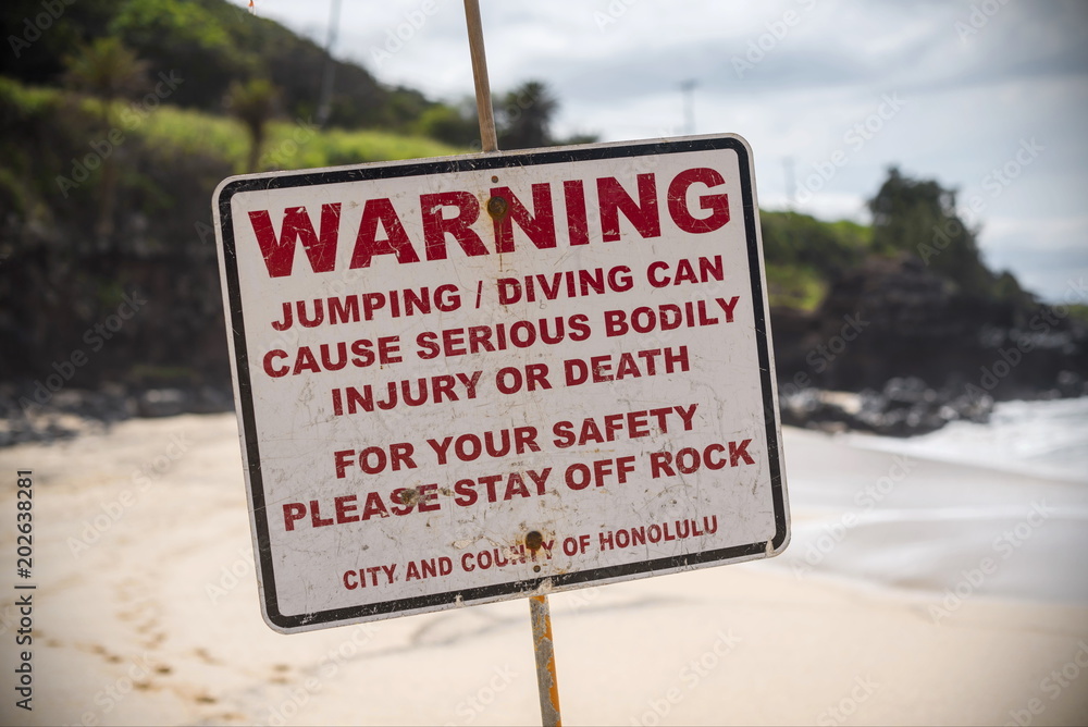 A Warning sign at the beach in the north shore of Oahu, Hawaii