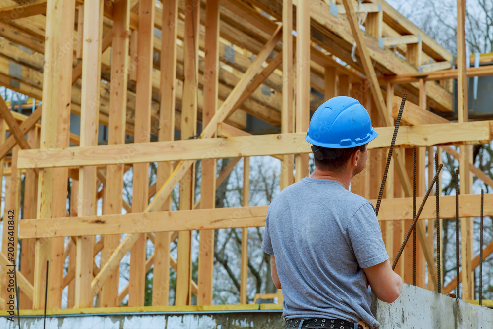 Builders on construction site new home under construction Builders on construction site new home under construction