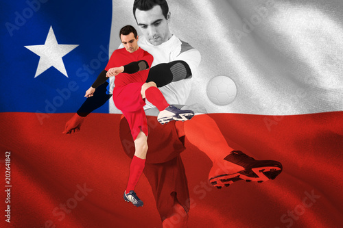 Football player in red kicking against digitally generated chile national flag