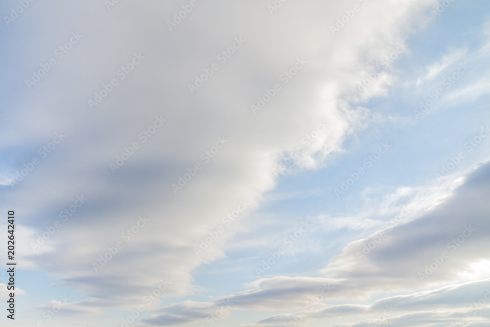 Large white Cumulus clouds on blue sky
