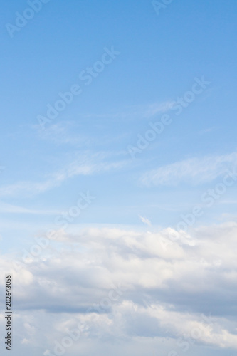 Large white Cumulus clouds on blue sky © Viktoriya09