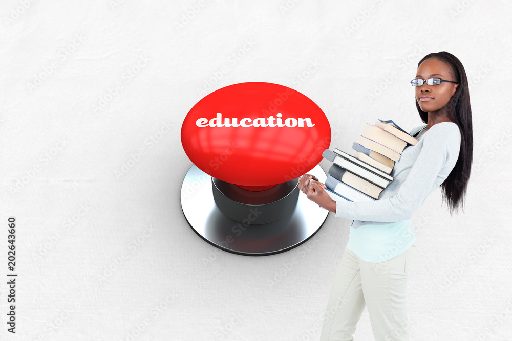 Φωτογραφία The word education and side view of young woman carrying a pile of books against