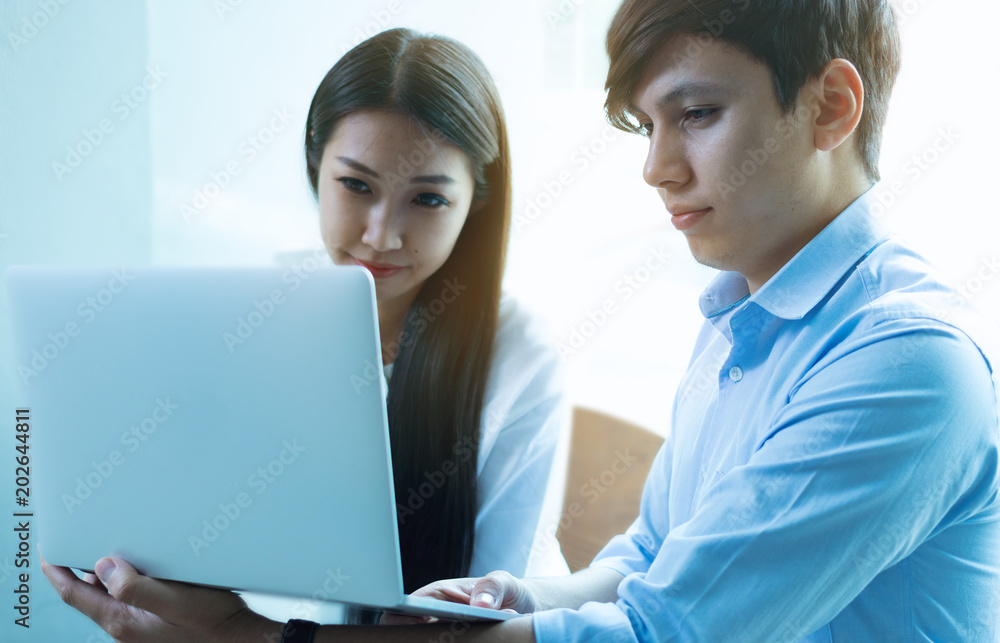 Male businessman and business woman are using laptops. Male businessman and business woman are using laptops.