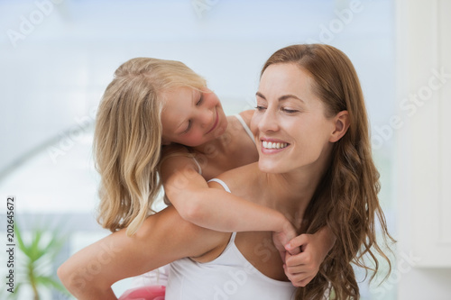 Close-up of a happy woman carrying girl © WavebreakmediaMicro