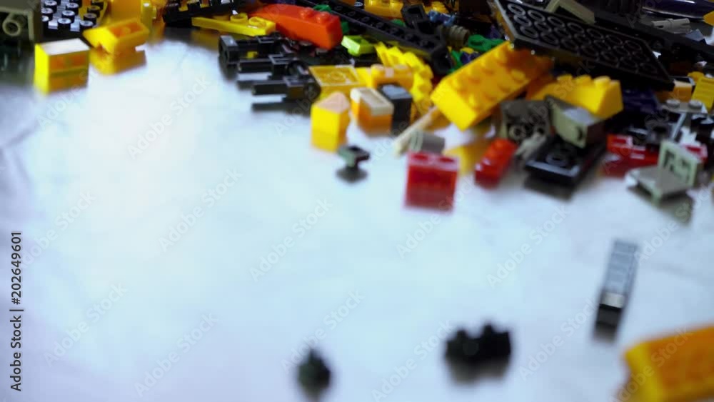 Colorful plastic designer at the table, building kit Colorful plastic designer at the table, building kit
