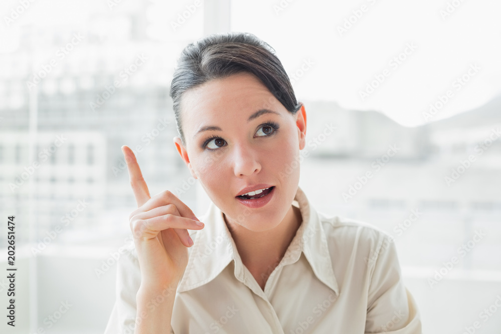 Fototapeta premium Elegant and thoughtful businesswoman in office