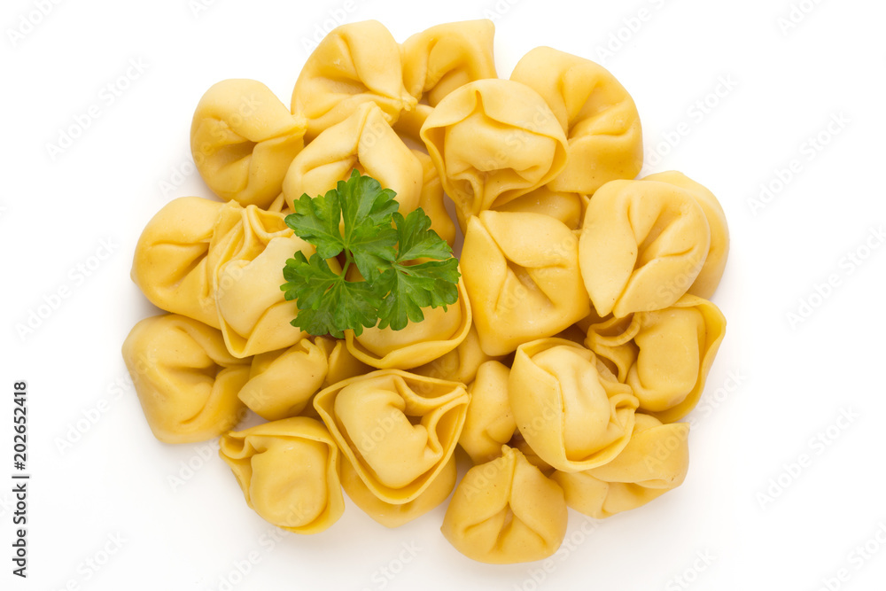 Raw homemade pasta,tortellini with herbs. Raw homemade pasta,tortellini with herbs.