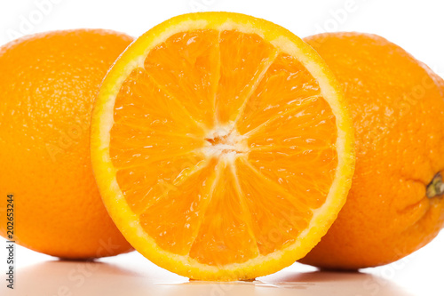 Orange and slice of orange on white background