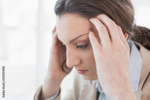 Close up side view of businesswoman suffering from headache © WavebreakmediaMicro