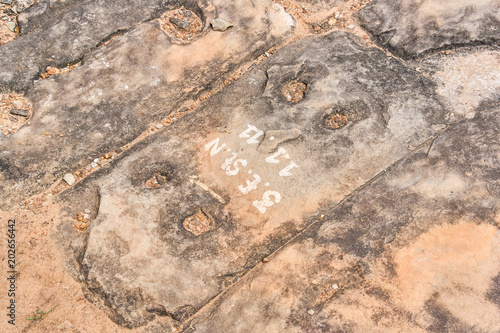 Numbers on ancient stone in Angkor temple, Siem Reap, Cambodia photo