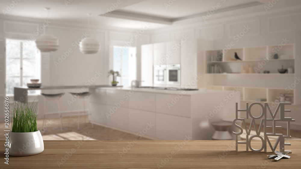 Wooden table, desk or shelf with potted grass plant, house keys and 3D letters making the words home sweet home, over minimalist white kitchen, architecture interior design, copy space background Wooden table, desk or shelf with potted grass plant, house keys and 3D letters making the words home sweet home, over minimalist white kitchen, architecture interior design, copy space background