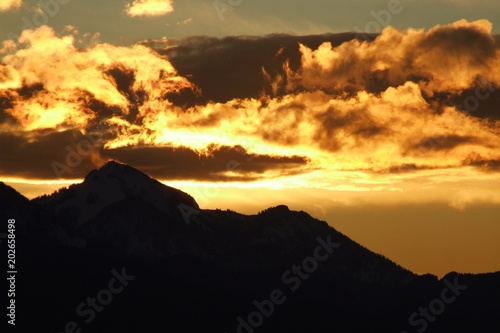 fiery sunset at Chiemgau alps near Siegsdorf with Mt. Hochgern, Bavaria, Germany