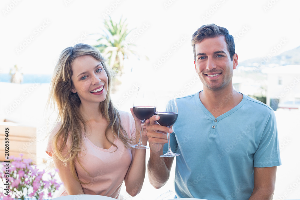 Young couple toasting wine glasses Young couple toasting wine glasses