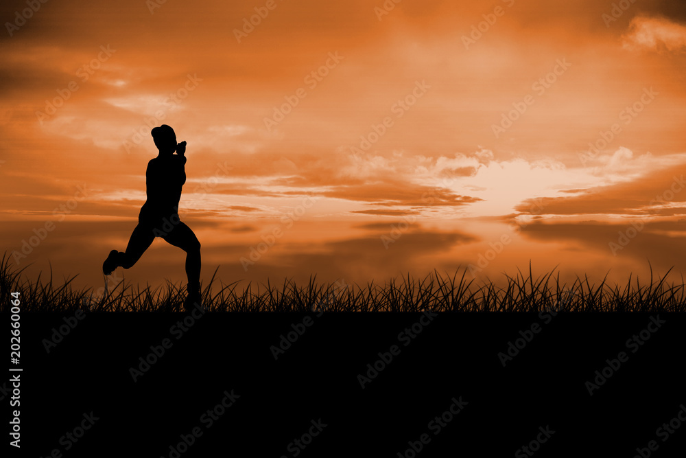 Fit brunette running and jumping against a couldy day