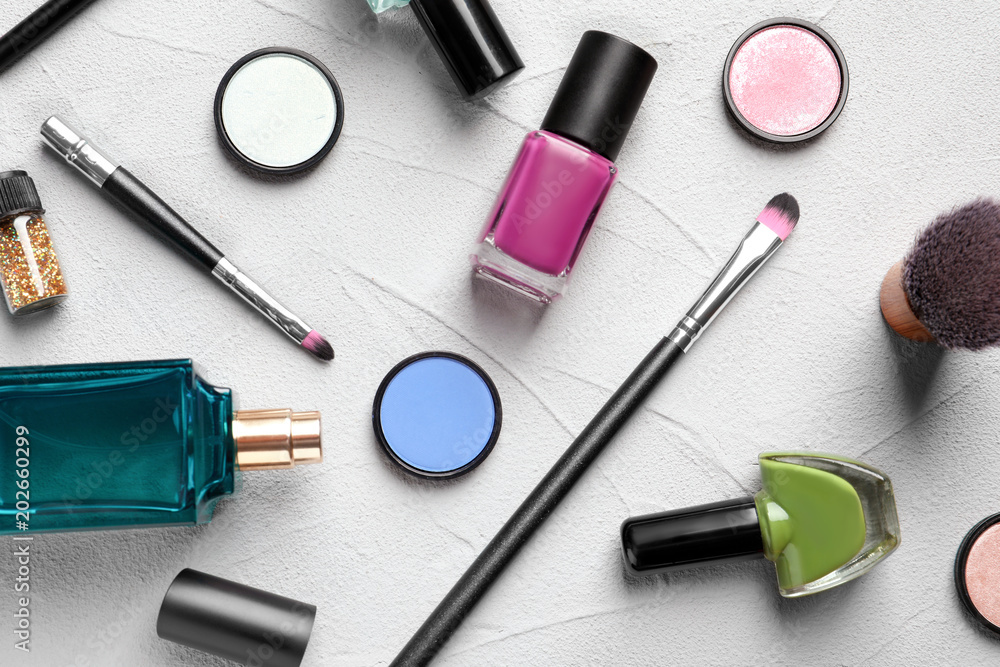 Flat lay composition with decorative cosmetics on gray background Flat lay composition with decorative cosmetics on gray background