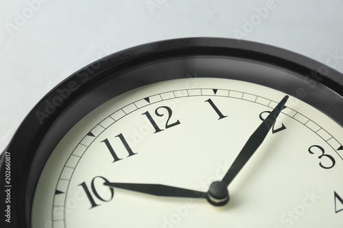 Big black clock, closeup. Time change concept
