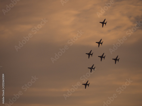 Airplanes in formation during an airshow © George
