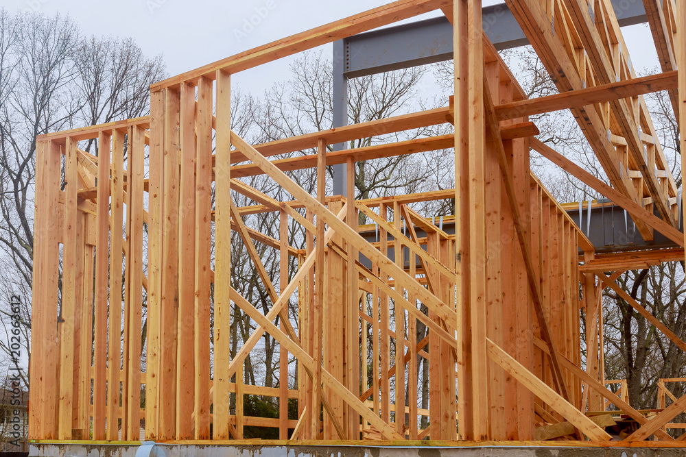 New home construction framing of a house on clear day New home construction framing of a house on clear day