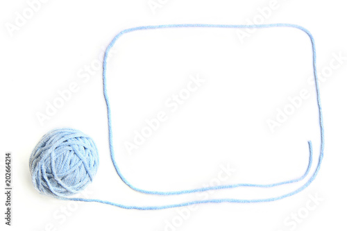 Blue thread ball with frame made of thread isolated on white background. Cotton thread ball with empty frame.