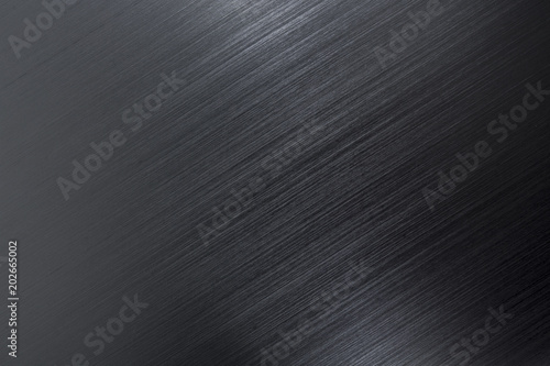 Close up industrial background of fractally scratched direct diagonal lines to silver metal/stainless steel surface. Creative detail macro photography. photo