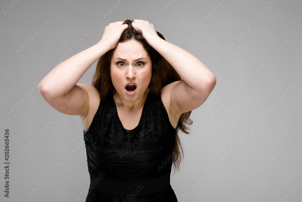 Angry overweight woman in fashionable clothes Angry overweight woman in fashionable clothes