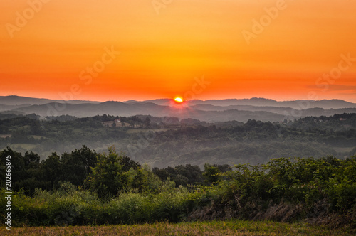 Amazing morning sunrise over the green hills