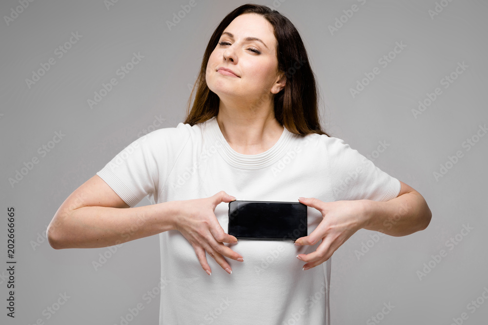 Young woman presenting telephone Young woman presenting telephone