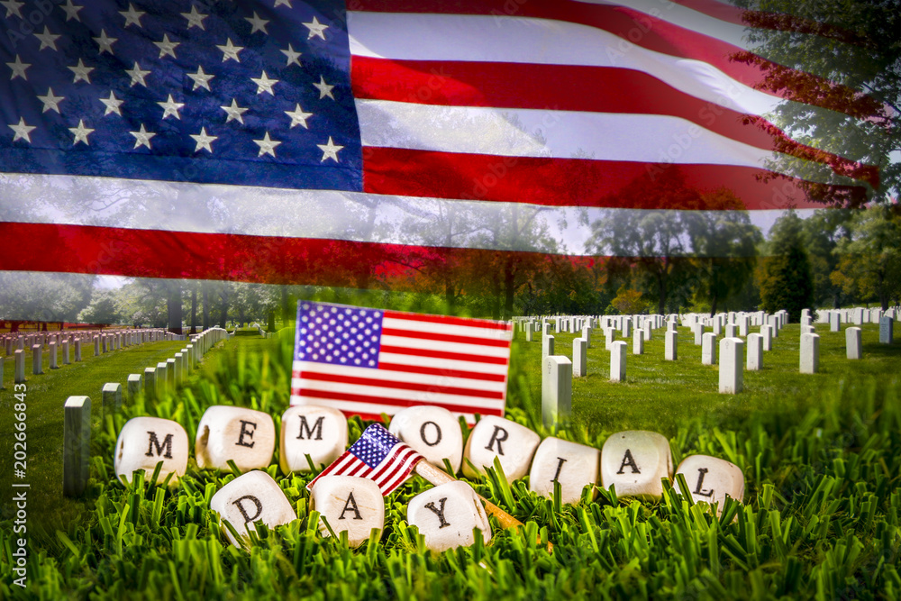 Great for Memorial Day. Grave stones in a row with US National flag and memorial day phrase formed by wooden letters