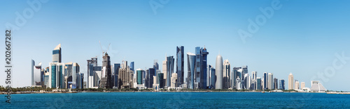 The morning panoramic view of the skyscrapers of Doha from the Persian Gulf. Futuristic skyline in the financial district of Qatar © sonatalitravel