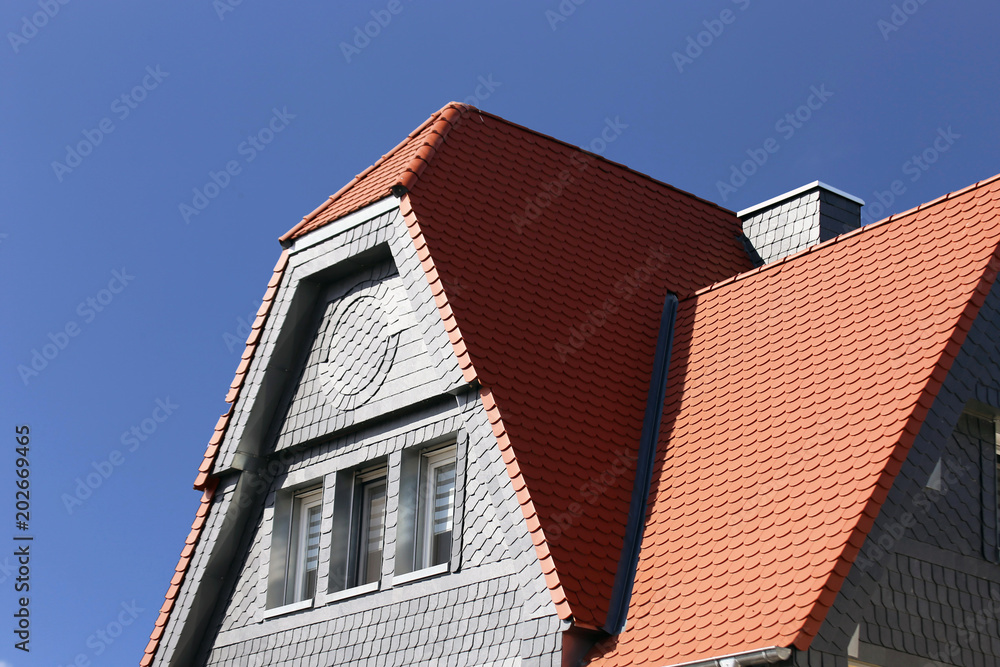Red tile roof with slate plates