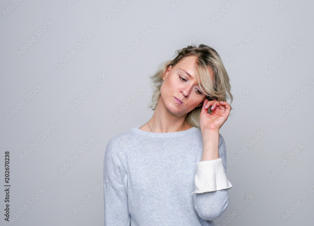 Adult sad woman posing in studio. Negative emotions.. Adult sad woman posing in studio. Negative emotions..