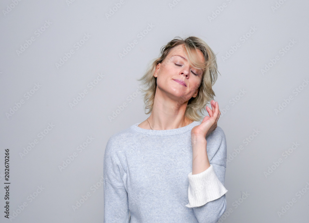 Adult sad woman posing in studio. Negative emotions.. Adult sad woman posing in studio. Negative emotions..