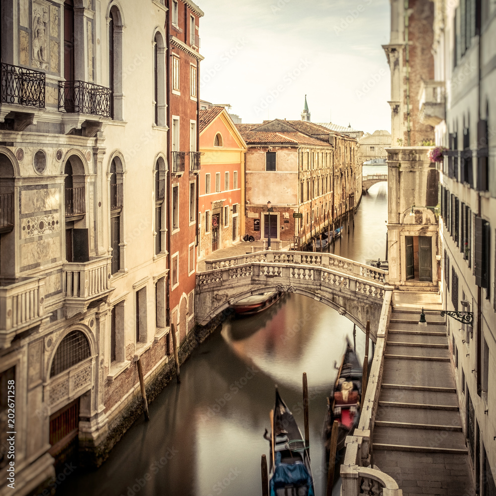 Peaceful morning view of a canal in Venice Italy.