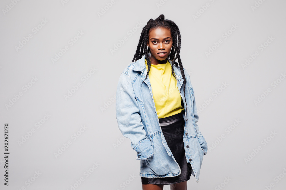 Εκτύπωση καμβά Cheerful afro american girl smilingstanding isolated against grey wall background