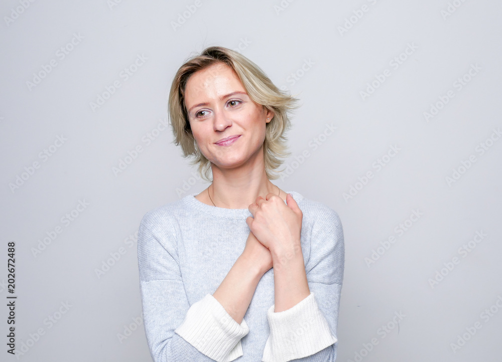 Adult tenderness woman posing in studio. Positive emotions. Tenderness.