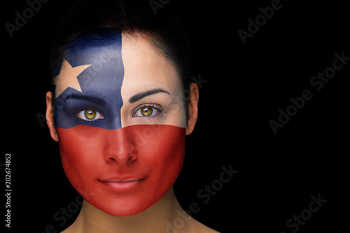 Composite image of chile football fan in face paint against black