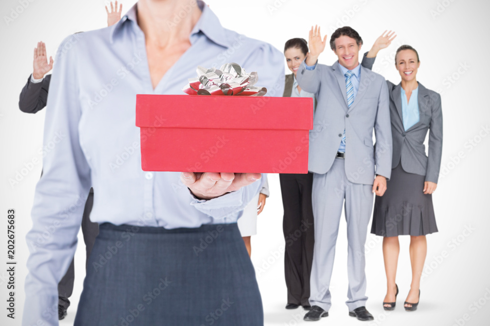 Businesswoman holding digital tablet against present Businesswoman holding digital tablet against present