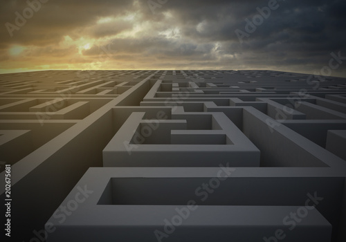 Maze at dusk on a gloomy dusk as 3d rendering.  A maze at dusk with a gloomy sky indicating turbulent and uncertain times ahead. photo